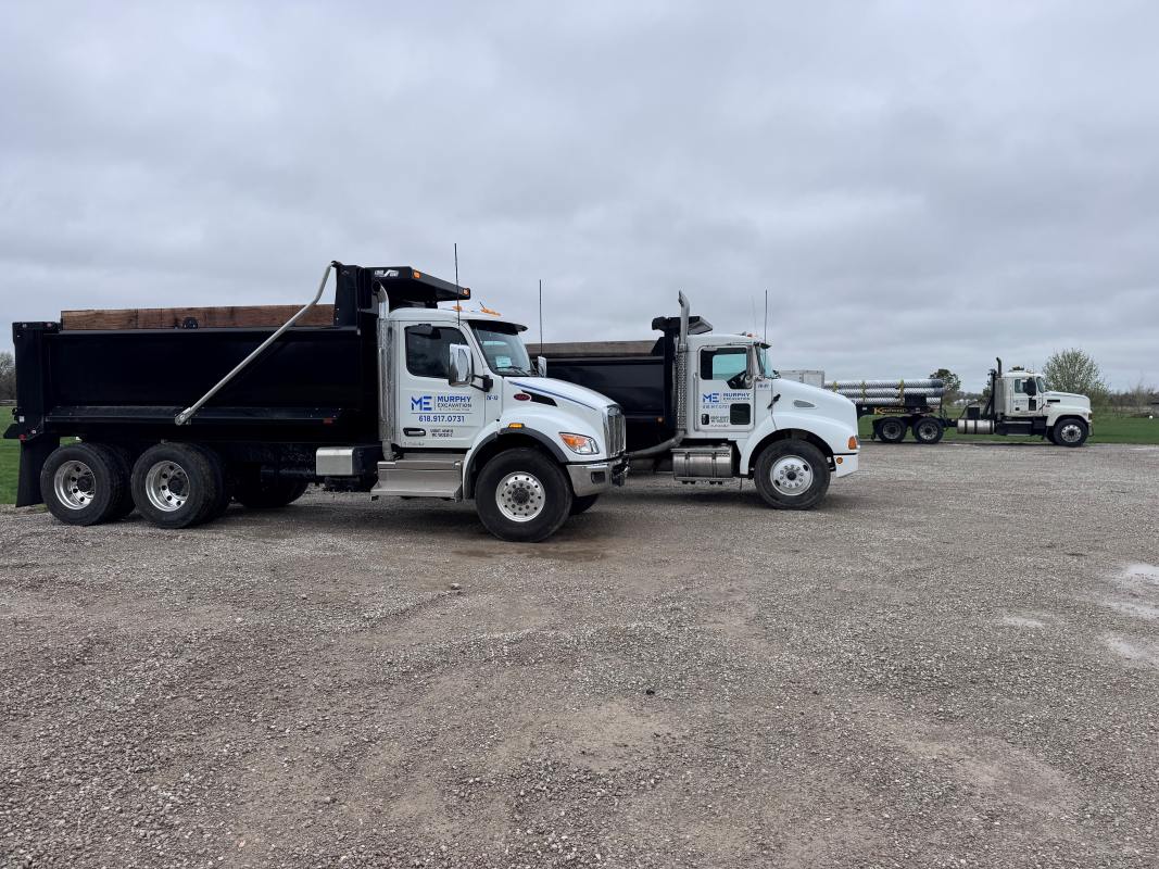 Dump trucks https://murphyexcavation.com/wp-content/uploads/Dump-trucks.jpg